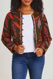 Model Ziara wearing size 10 of the Reckless Reversible Jacket in colour Reckless (Green), from the front, cropped image