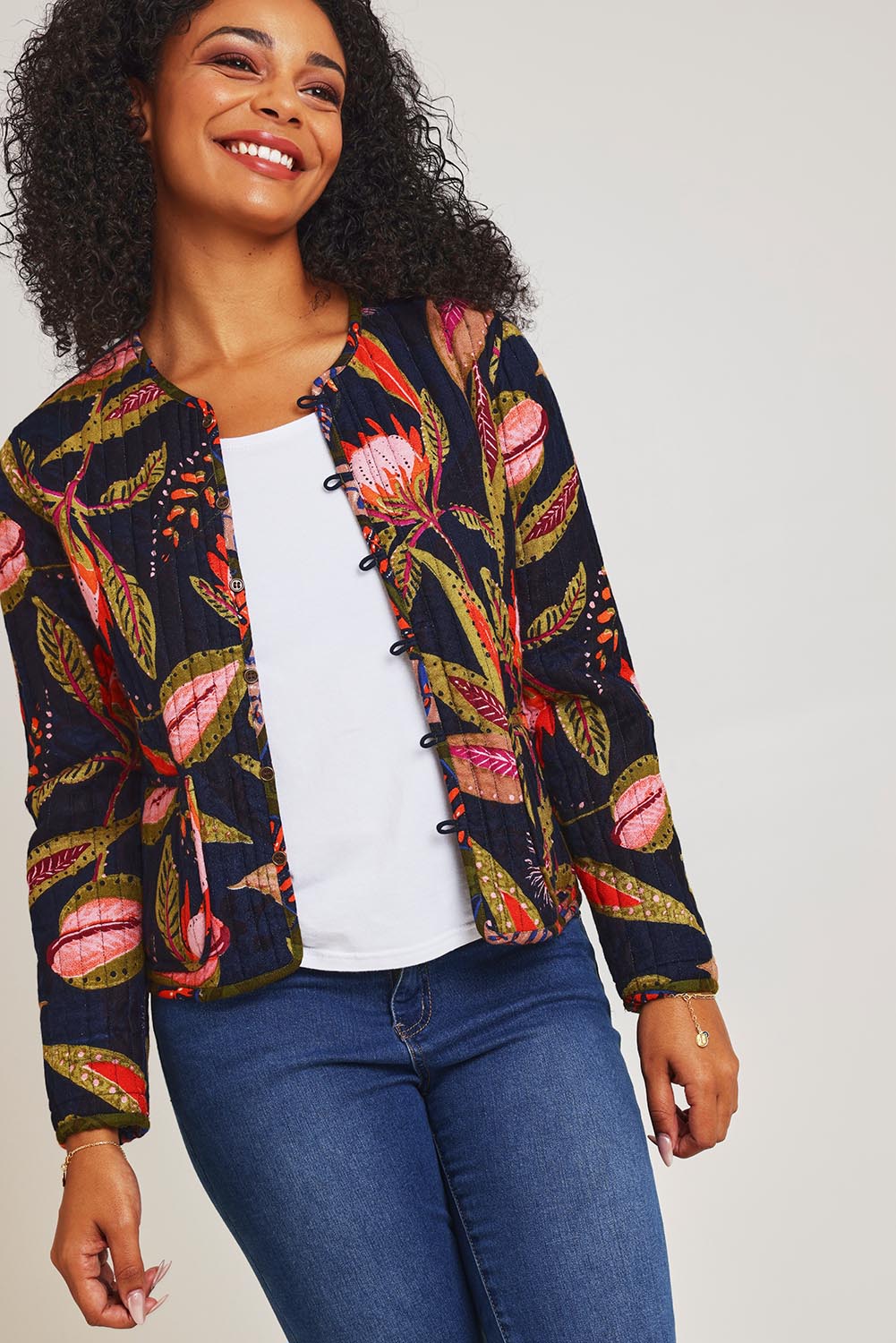 Model Ziara wearing size 10 of the Reckless Reversible Jacket in colour Reckless (Green), from the front, cropped image