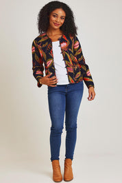 Model Ziara wearing size 10 of the Reckless Reversible Jacket in colour Reckless (Green), from the front, showing the whole outfit