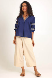 Model Pamelar wearing size 10 of the Essentials Embroidered Cotton Top - Navy in colour Navy, from the front