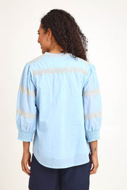 Model Pamelar wearing size 10 of the Essentials Embroidered Cotton Top - Sky in colour Sky, from an angle