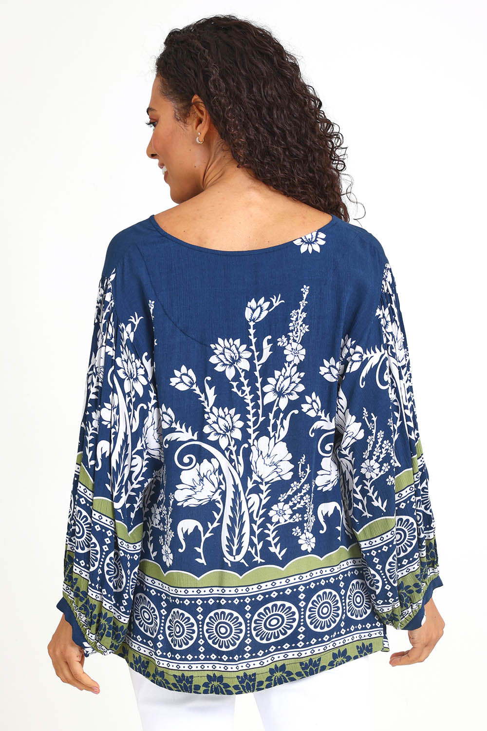 Model Pamelar wearing size 10 of the Paisley Border Top – Navy in colour Navy, from the back