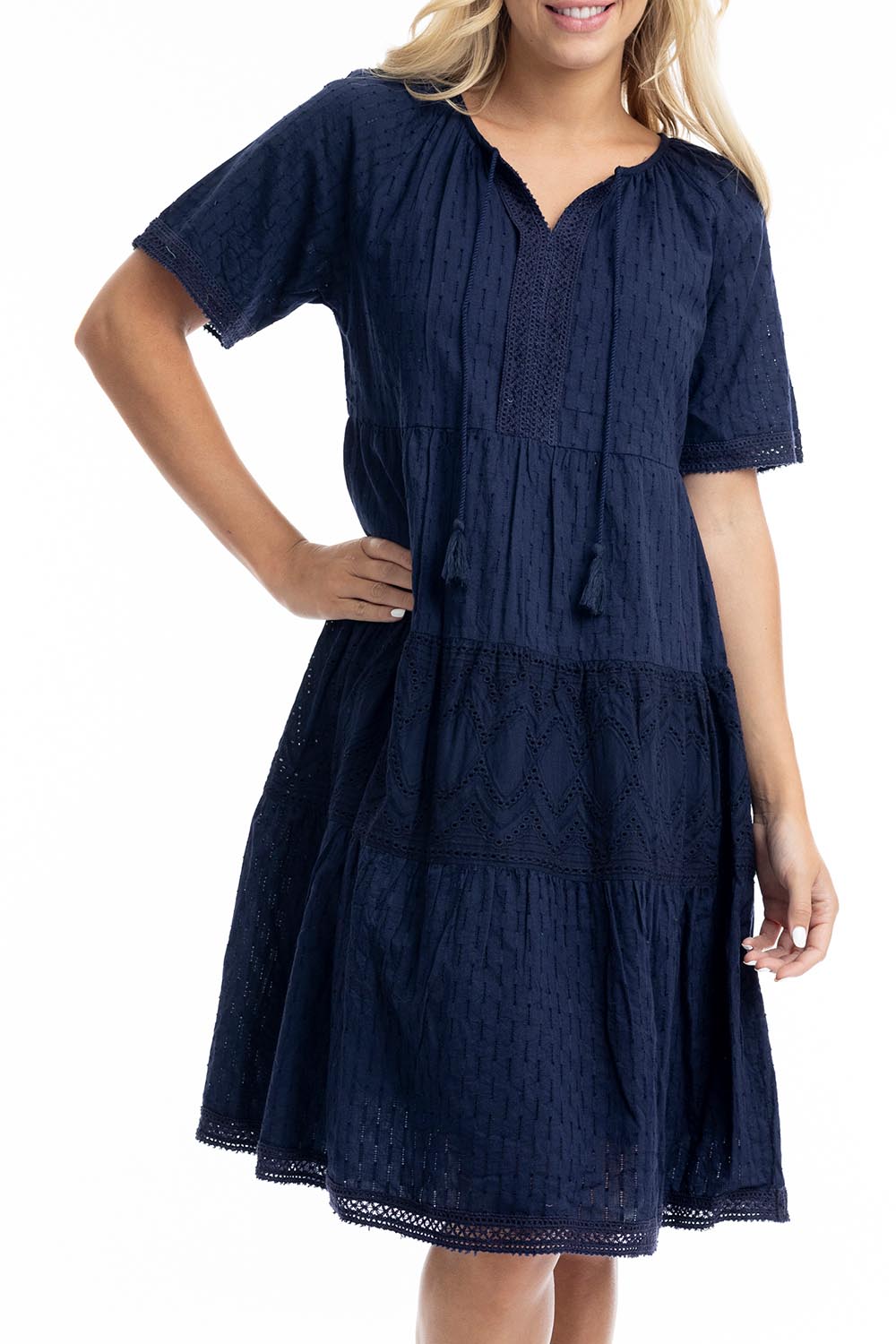 A model wearing the Essential Broderie Layers Cotton Dress in colour Navy (Blue), from the front, cropped image