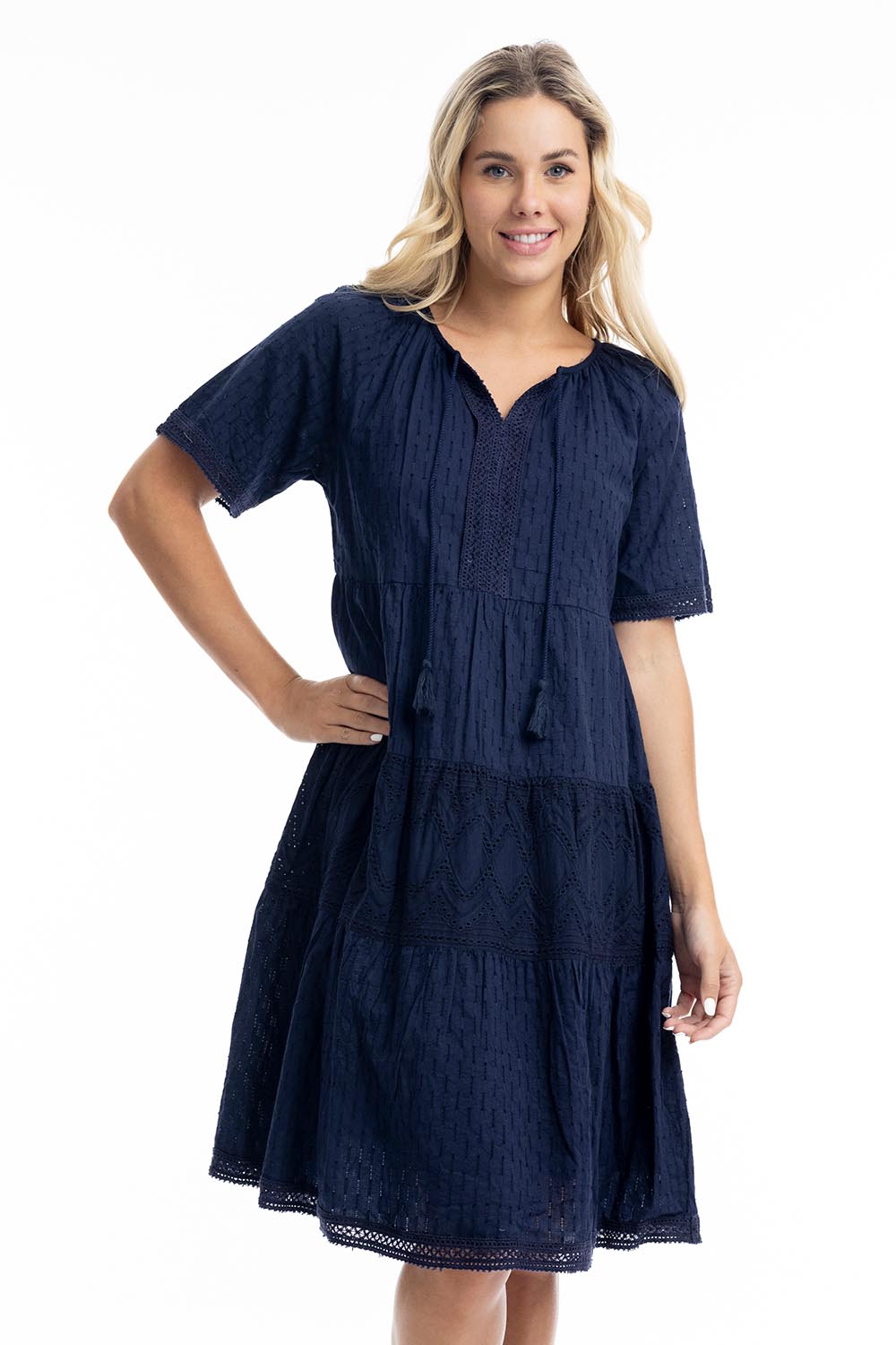 A model wearing the Essential Broderie Layers Cotton Dress in colour Navy (Blue), from the front, cropped image