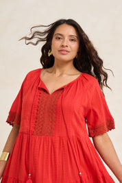 Model Tahnee wearing size 10 of the Essential Broderie Layers Cotton Dress in colour Red (Red), from the front, showing the whole outfit