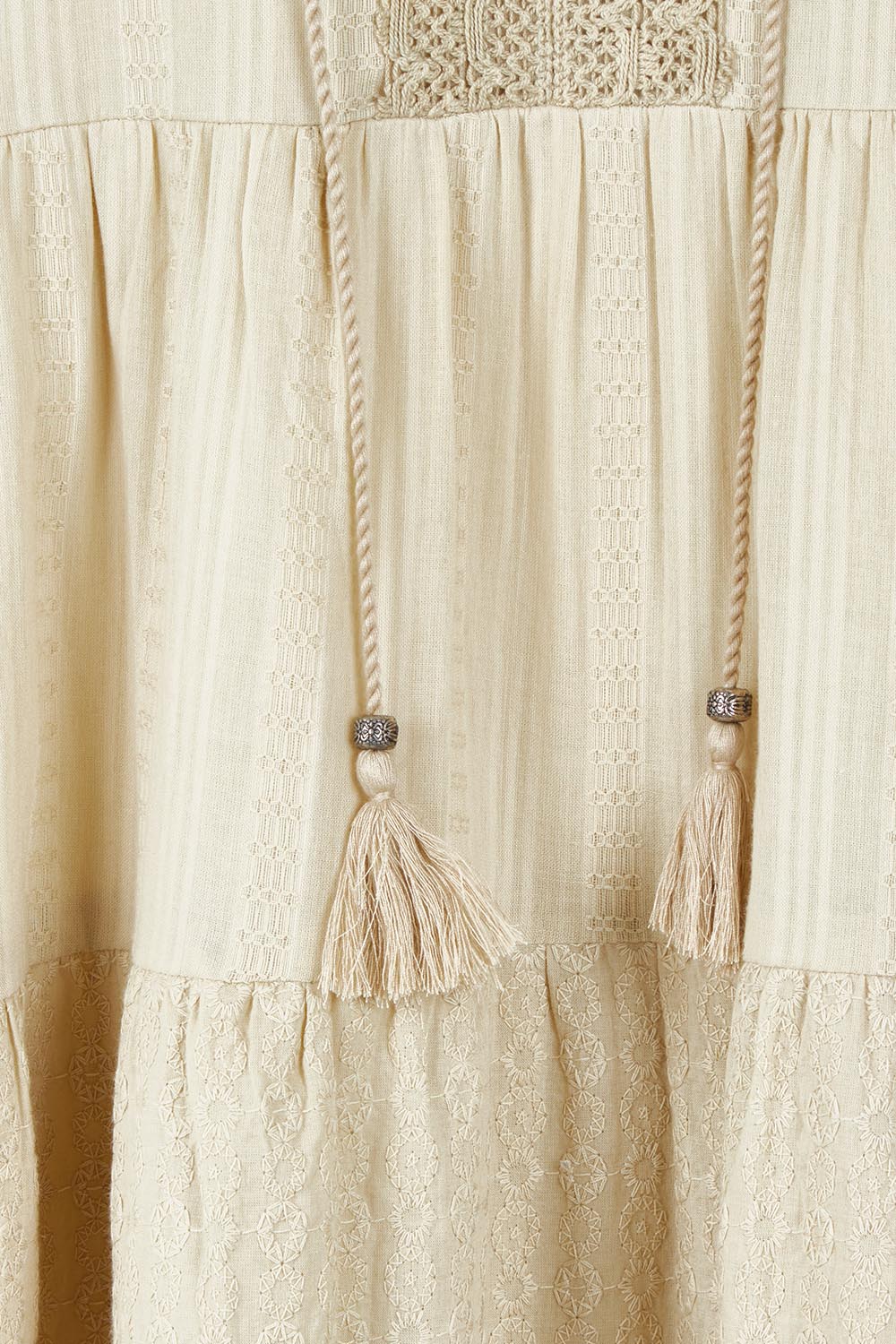 Product shot of the Essential Broderie Layers Cotton Dress in colour Sand, detail