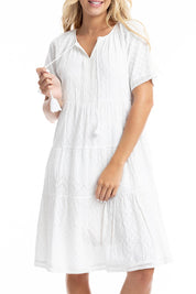 A model wearing the Essential Broderie Layers Cotton Dress in colour White (White), from the front, cropped image