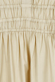 Product shot of the Essentials Organic Cotton Poplin Maxi Ruched Waist Dress in colour Sand, detail