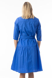 A model wearing the Essentials Organic Cotton Poplin Button through Belt dress in colour Blue (Blue), from the back