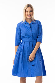 A model wearing the Essentials Organic Cotton Poplin Button through Belt dress in colour Blue (Blue), from the front, cropped image