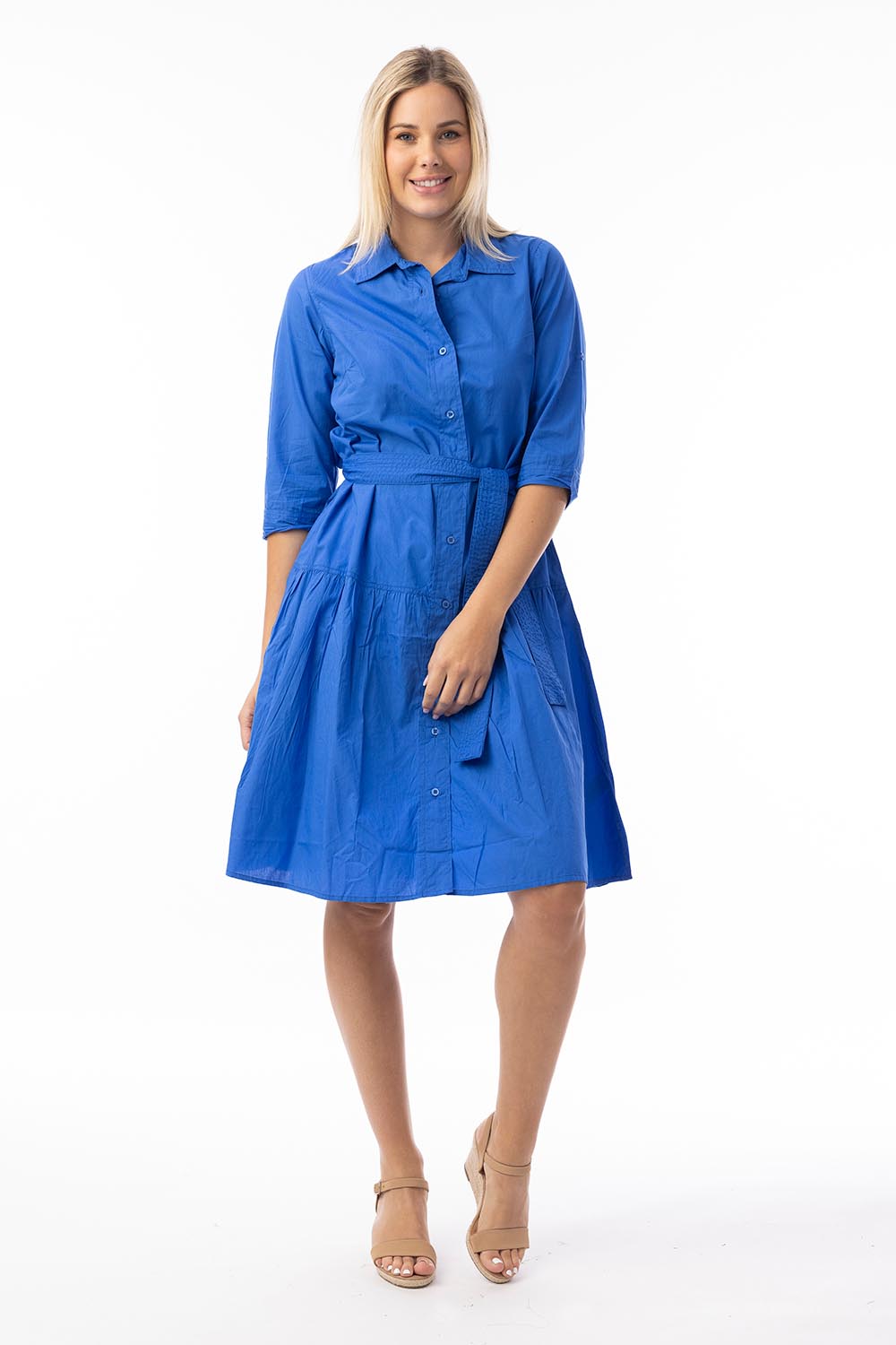 A model wearing the Essentials Organic Cotton Poplin Button through Belt dress in colour Blue (Blue), from the front, showing the whole outfit