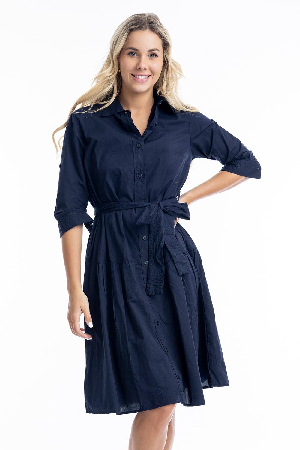 A model wearing the Essentials Organic Cotton Poplin Button through Belt dress in colour Navy (Blue), from the front, cropped image