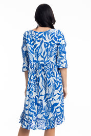 A model wearing the Hayman Cotton Blend Pinch Pleat Frill Sleeve Dress in colour Blue (Blue), from the back