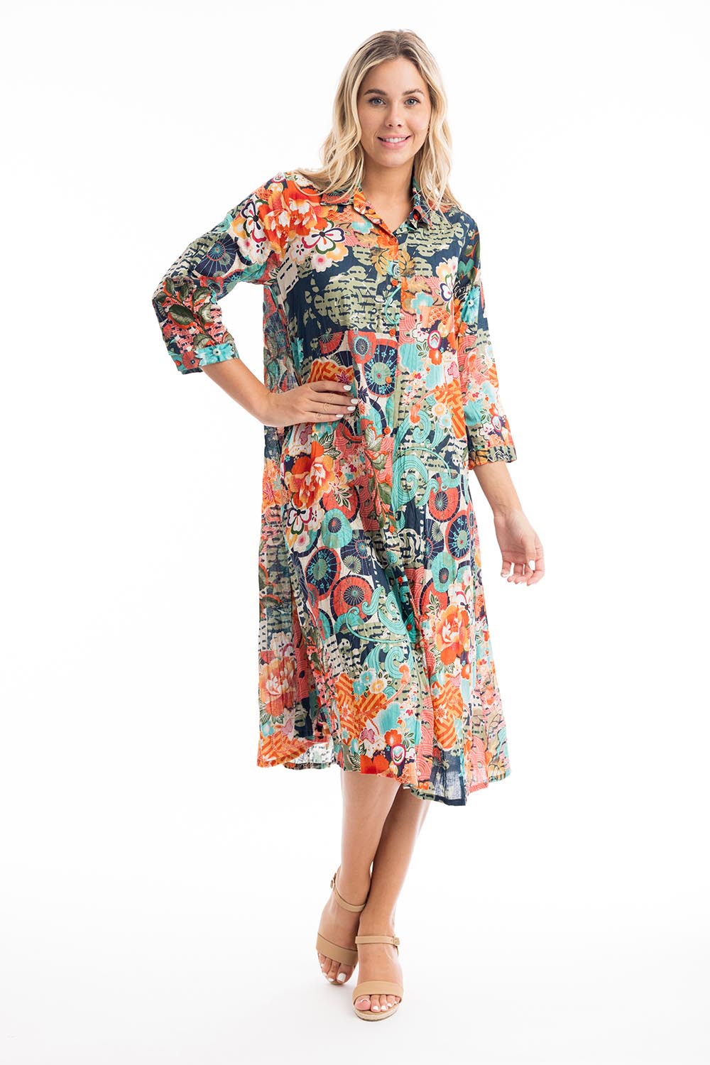 A model wearing the Yakushima Organic Cotton Patch Dress in colour Print (Blue), from the front, showing the whole outfit