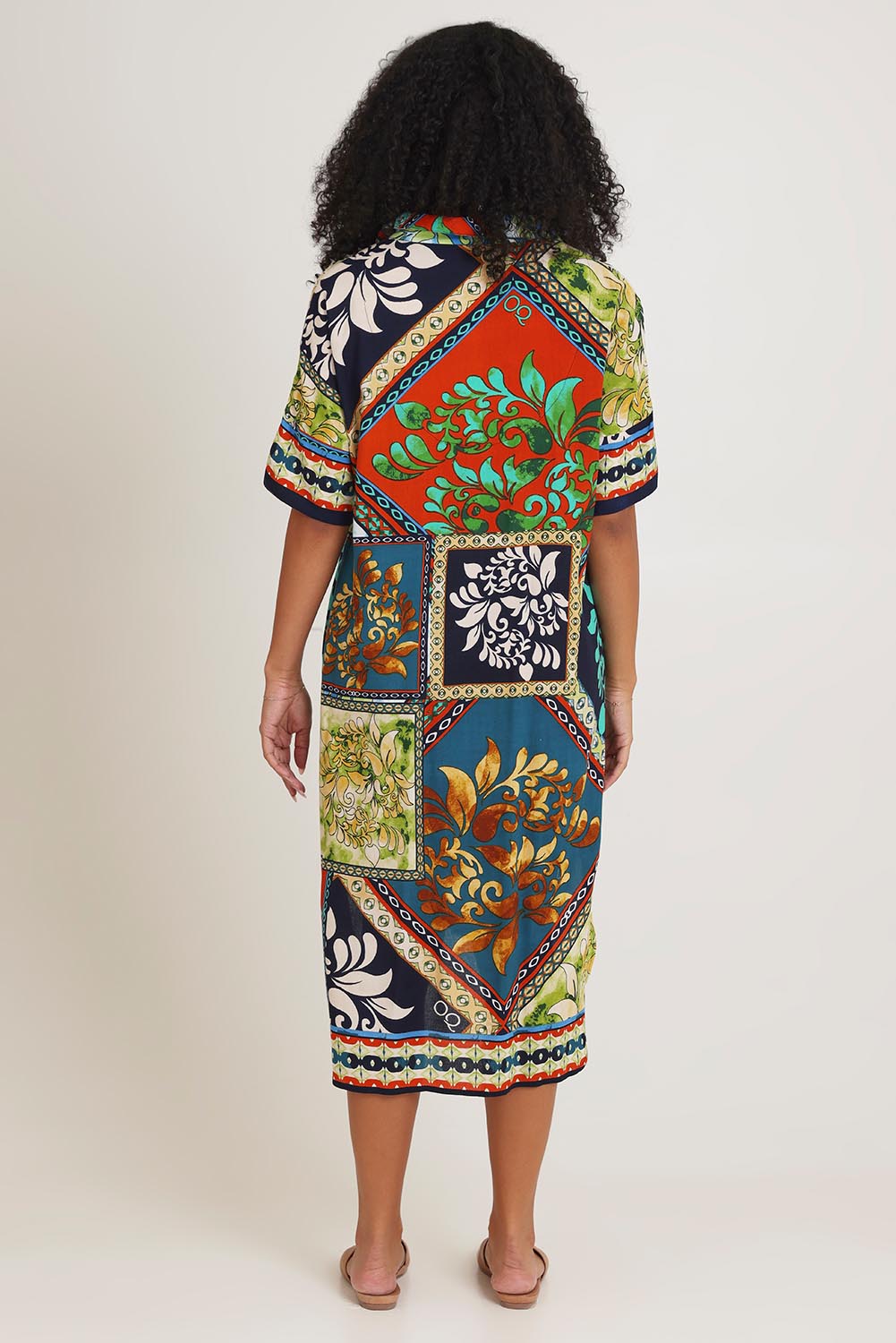 Model Ziara wearing size 10 of the Shirt Dress in colour Cabofria, from the back