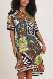 Model Ziara wearing size 10 of the Shirt Dress in colour Cabofria, from the front, cropped image