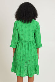 Model Ziara wearing size 10 of the Essentials Frill Hem Broderie Cotton Dress in colour Green (Green), from the back