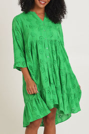 Model Ziara wearing size 10 of the Essentials Frill Hem Broderie Cotton Dress in colour Green (Green), from the front, cropped image