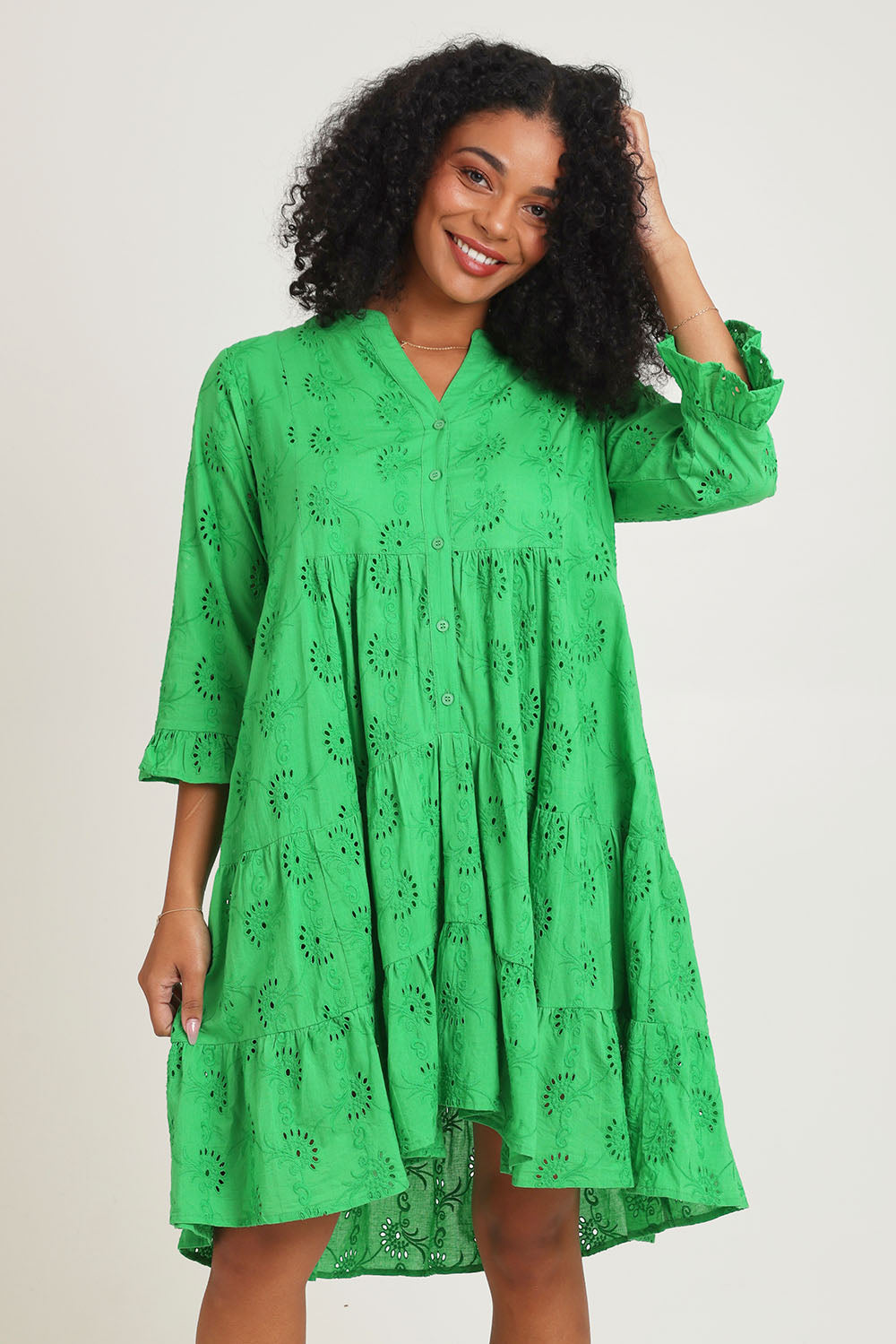 Model Ziara wearing size 10 of the Essentials Frill Hem Broderie Cotton Dress in colour Green (Green), from the front, cropped image