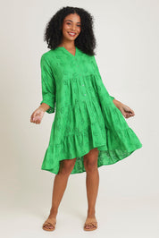 Model Ziara wearing size 10 of the Essentials Frill Hem Broderie Cotton Dress in colour Green (Green), from the front, showing the whole outfit