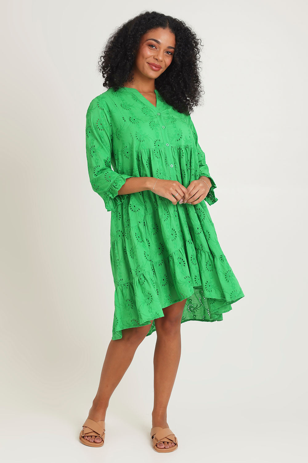 Model Ziara wearing size 10 of the Essentials Frill Hem Broderie Cotton Dress in colour Green (Green), from the front, showing the whole outfit