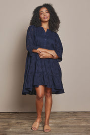 Model Ziara wearing size 10 of the Essentials Frill Hem Broderie Cotton Dress in colour Navy (Blue), from the front, showing the whole outfit