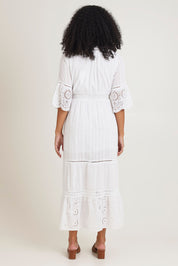 Model Ziara wearing size 10 of the Essentials Maxi Broderie Cotton Dress in colour White (White), from the back