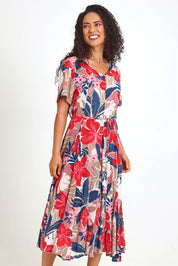 Model Pamelar wearing size 10 of the Godet Dress – Print in colour Print, from an angle