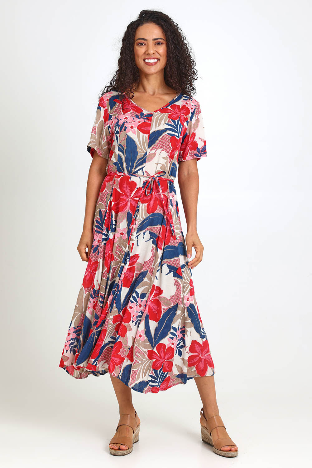 Model Pamelar wearing size 10 of the Godet Dress – Print in colour Print, from the front