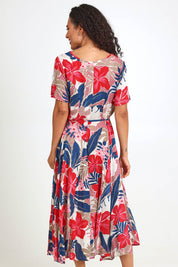 Model Pamelar wearing size 10 of the Godet Dress – Print in colour Print, from the front