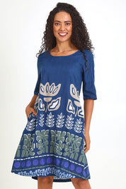 Model Pamelar wearing size 10 of the Contemporary Dress – Blue in colour Blue, in a cropped view