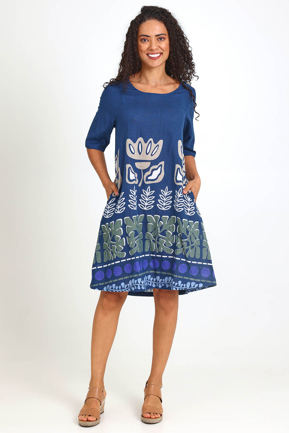 Model Pamelar wearing size 10 of the Contemporary Dress – Blue in colour Blue, from the front