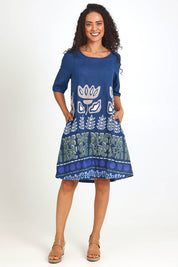 Model Pamelar wearing size 10 of the Contemporary Dress – Blue in colour Blue, from the front