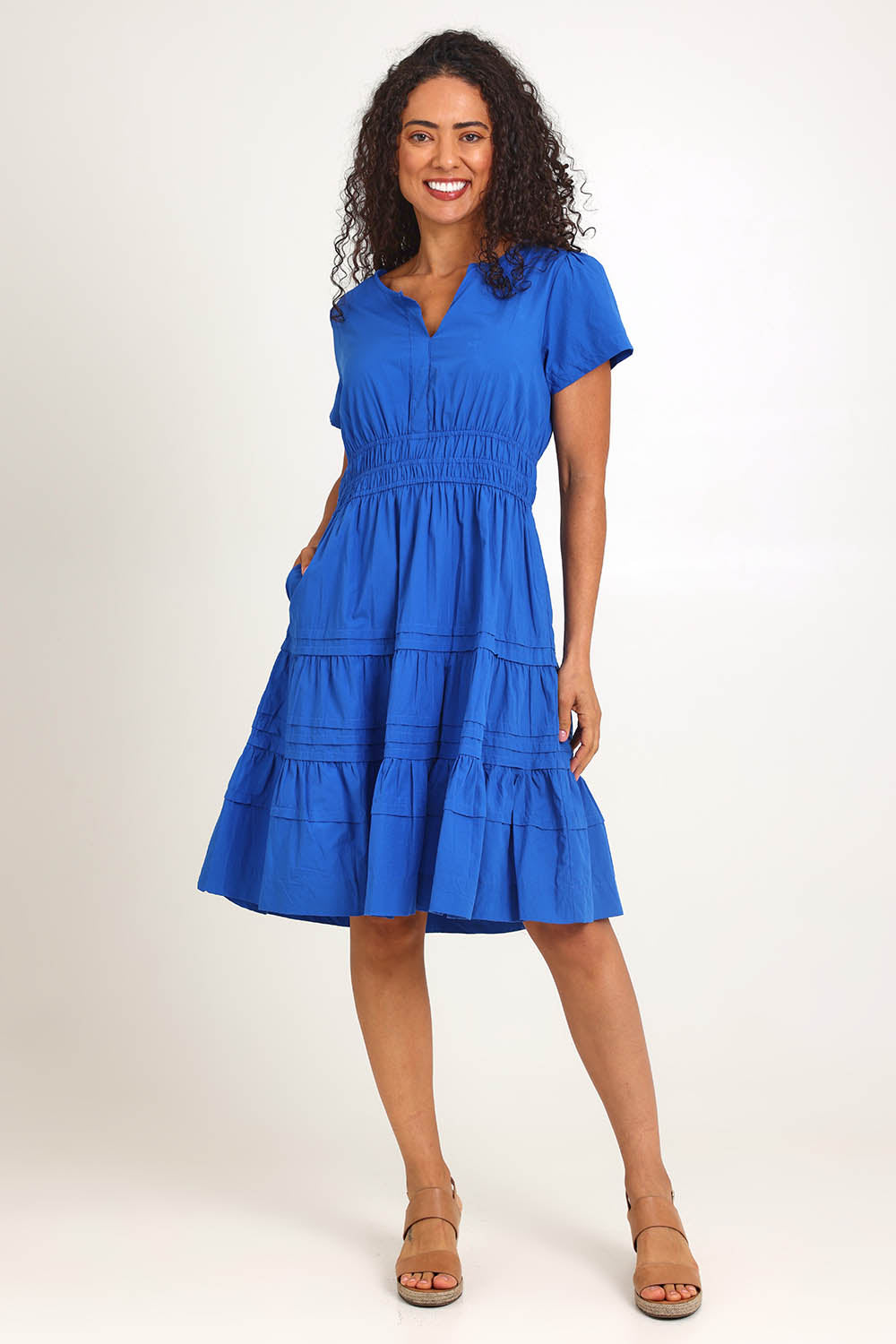 Model Pamelar wearing size 10 of the Essentials Poplin Short Sleeve Cotton Short Dress - Blue in colour Blue, from the front