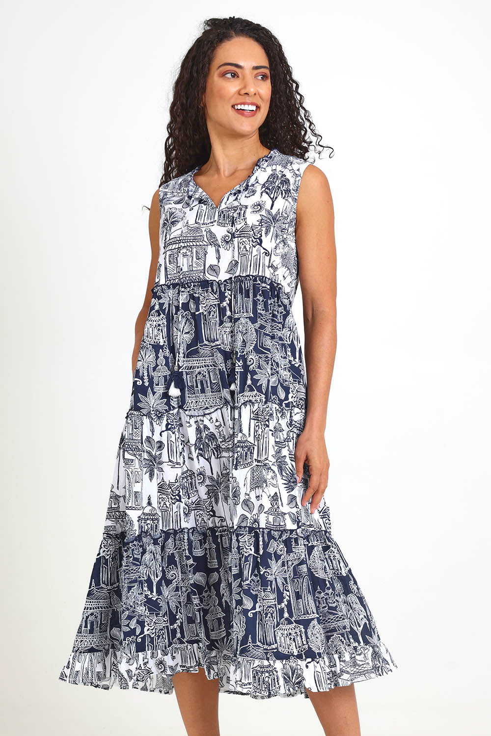 Model Pamelar wearing size 10 of the Sleeveless Layers Dress – Mix in colour Mix, from the front