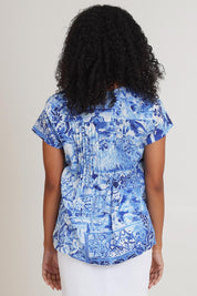 Model Ziara wearing size 10 of the Pleated Cotton Top in colour Okayama (Blue), from the back