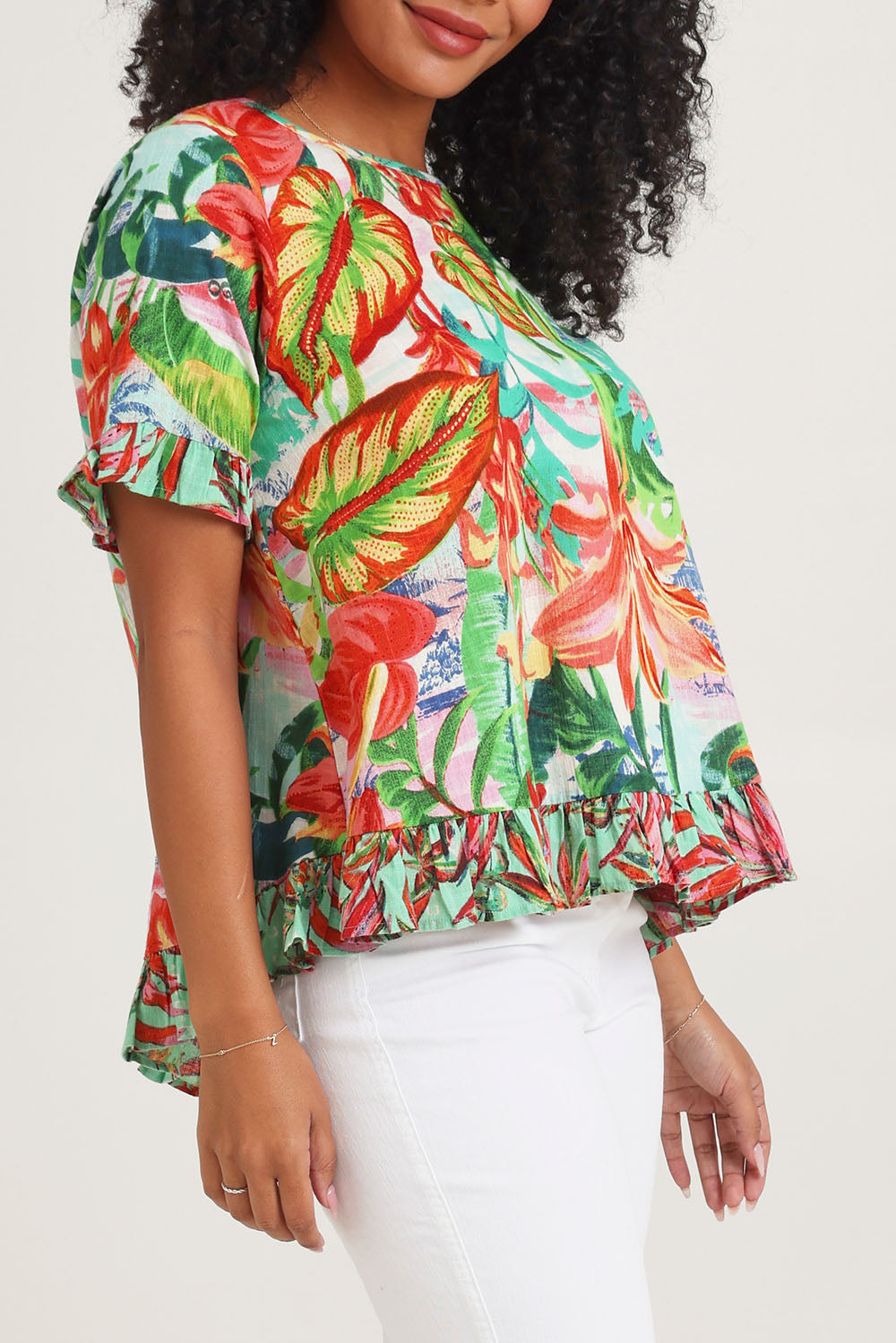 Model Ziara wearing size 10 of the Cotton Frill Top in colour Equador, from the front, cropped image