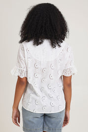 Model Ziara wearing size 10 of the Essentials Broderie Cotton Top in colour White (White), from the back