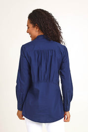 Model Pamelar wearing size 10 of the Essentials Poplin Cotton Shirt - Navy in colour Navy, from an angle