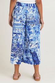 Model Ziara wearing size 10 of the Okayama Cotton Pant in colour Okayama (Blue), from the back