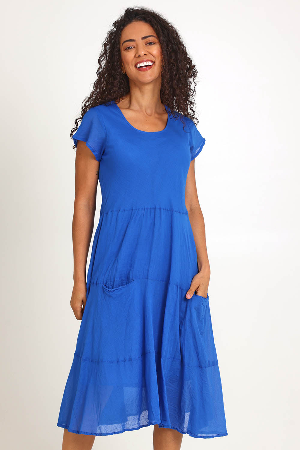 Model Pamelar wearing size 10 of the Essentials Bias Pockets Cotton Dress - Blue in colour Blue, from the front