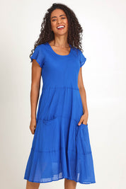 Model Pamelar wearing size 10 of the Essentials Bias Pockets Cotton Dress - Blue in colour Blue, from the front