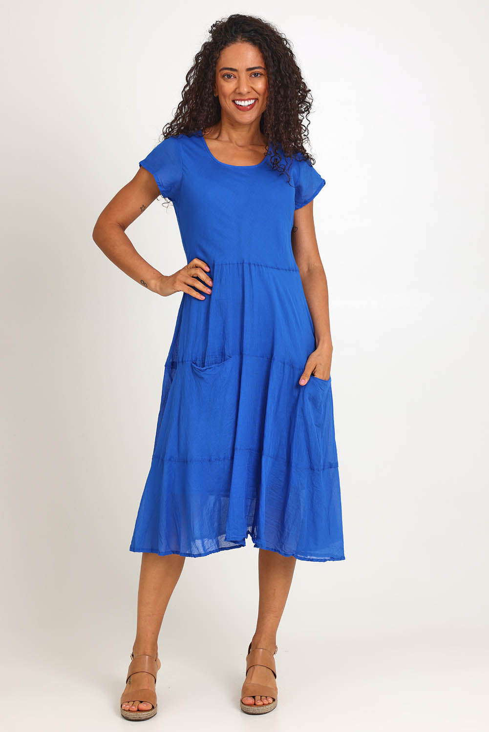 Model Pamelar wearing size 10 of the Essentials Bias Pockets Cotton Dress - Blue in colour Blue, from the front