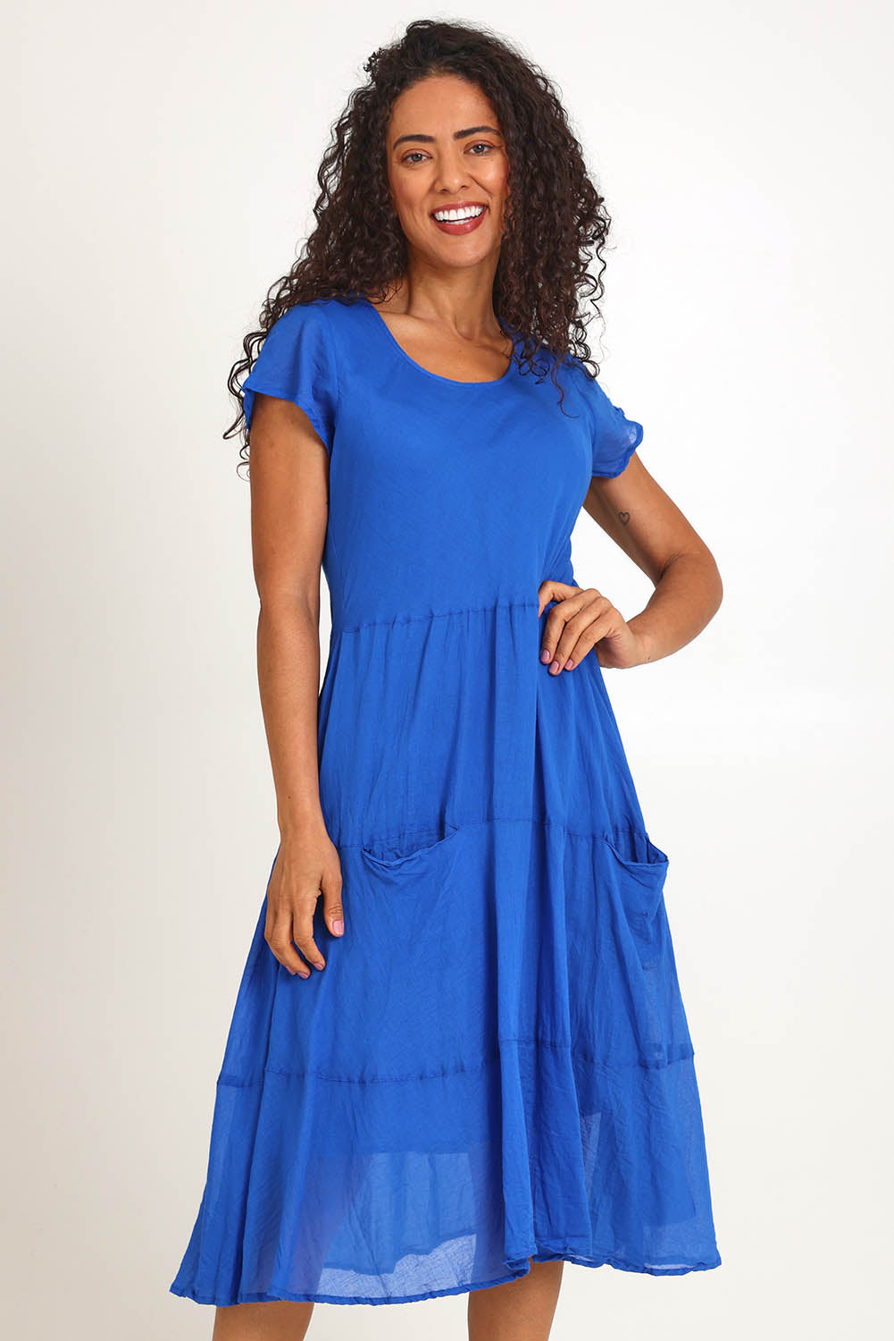 Model Pamelar wearing size 10 of the Essentials Bias Pockets Cotton Dress - Blue in colour Blue, from the front