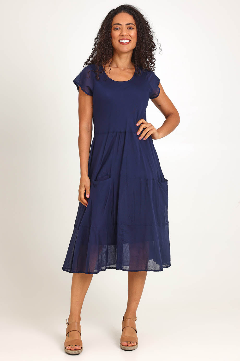 Model Pamelar wearing size 10 of the Essentials Bias Pockets Cotton Dress - Navy in colour Navy, from the front