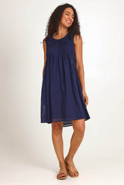 Model Pamelar wearing size 10 of the Essentials Easy Fit Sleeveless Cotton Dress - Navy in colour Navy, from the front