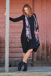 Model Katie wearing size 10 of the Bubble Dress in colour Black (Black), from the front, showing the whole outfit