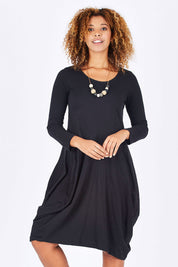 Model Summer wearing size 10 of the Bubble Dress in colour Black (Black), from the front, cropped image