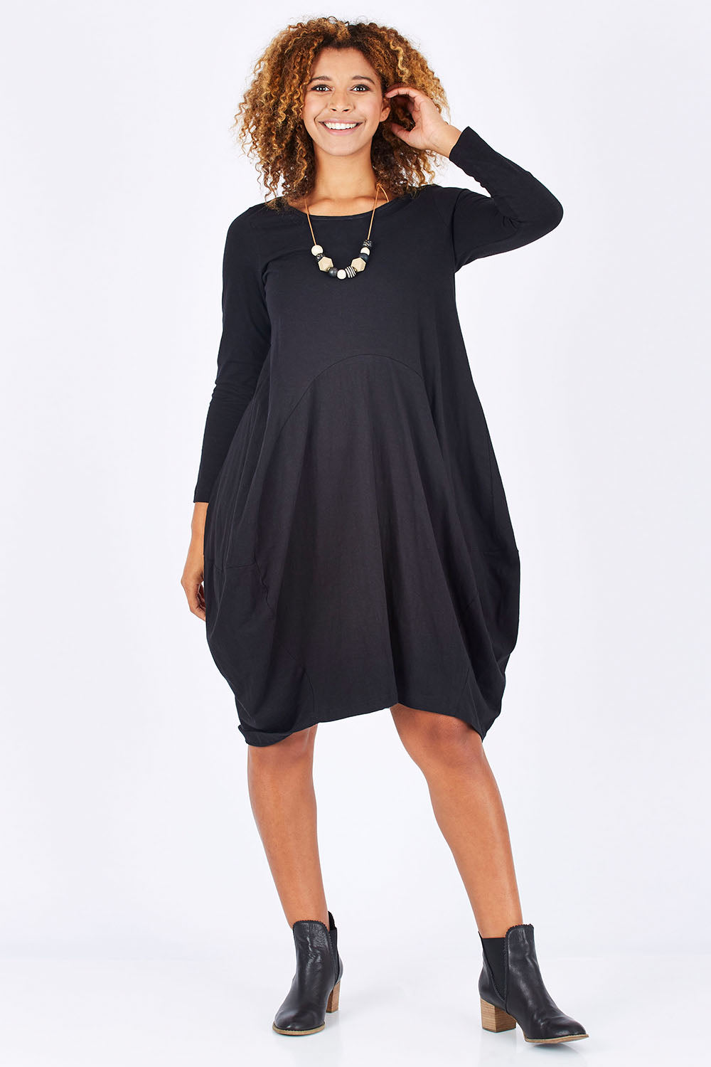 Model Summer wearing size 10 of the Bubble Dress in colour Black (Black), from the front, showing the whole outfit