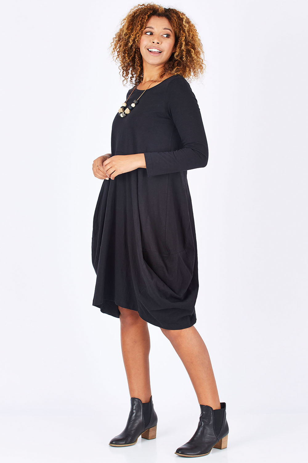 Model Summer wearing size 10 of the Bubble Dress in colour Black (Black), from the front, showing the whole outfit